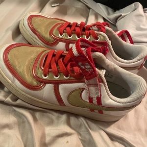 Used red and gold Nikes